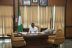 Governor-Okowa-working-on-some-files-on-his-desk.jpg